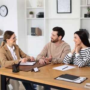 Family Lawyer Discussing Legal Matters with Clients in Office